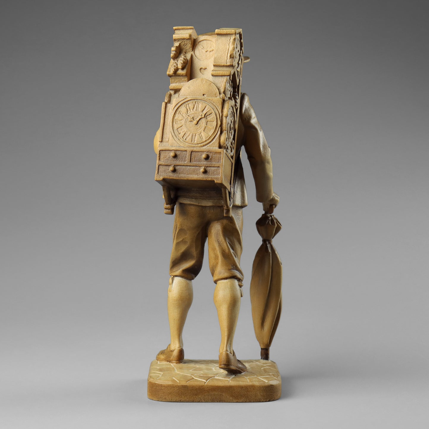 Carved Clock Peddler Statue