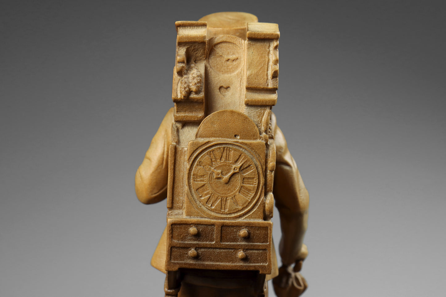 Carved Clock Peddler Statue