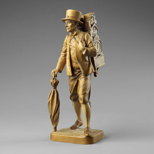 Carved Clock Peddler Statue