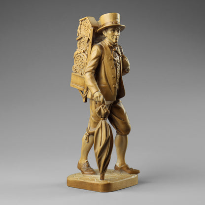 Carved Clock Peddler Statue