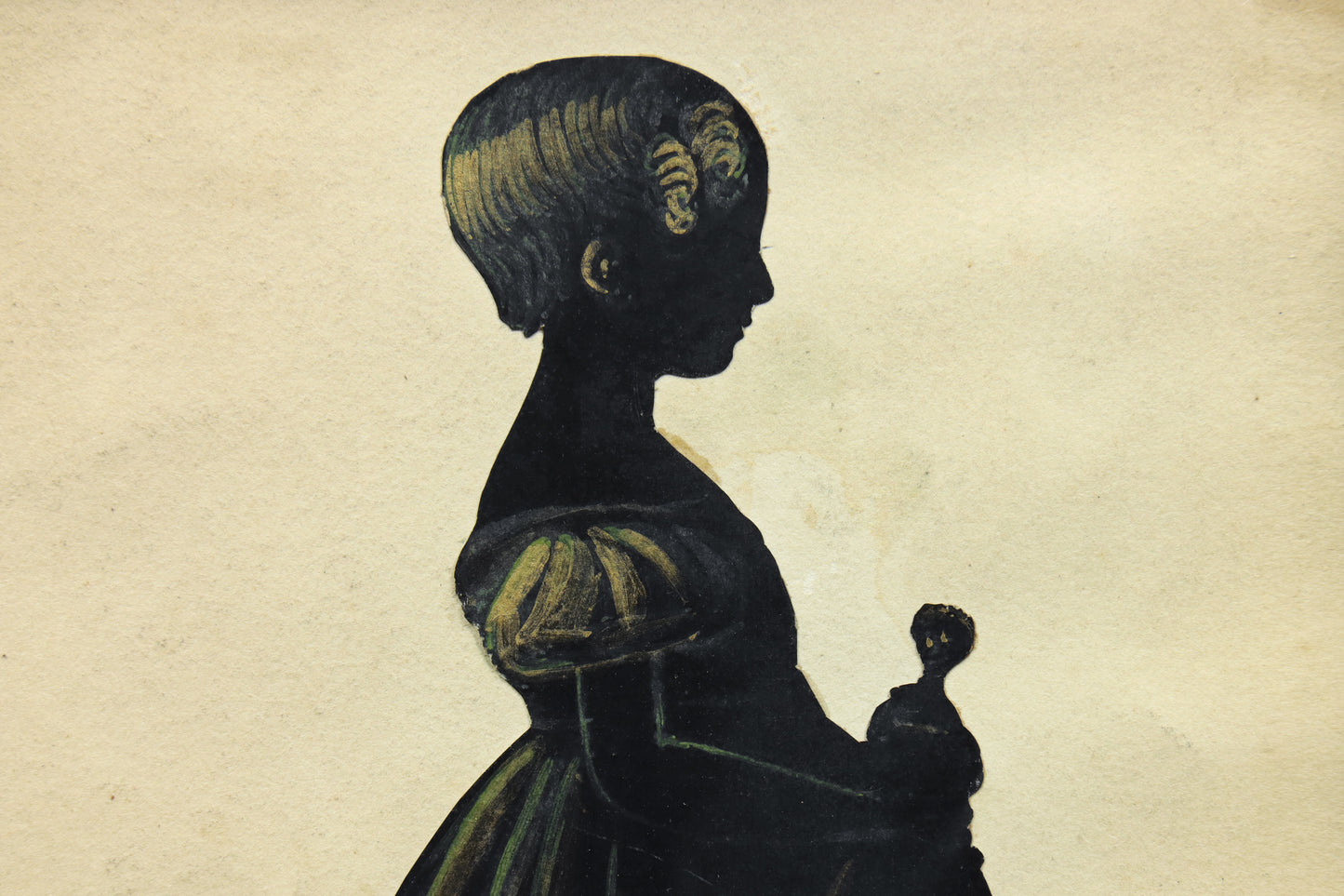 Cut Silhouette of a Girl With Doll