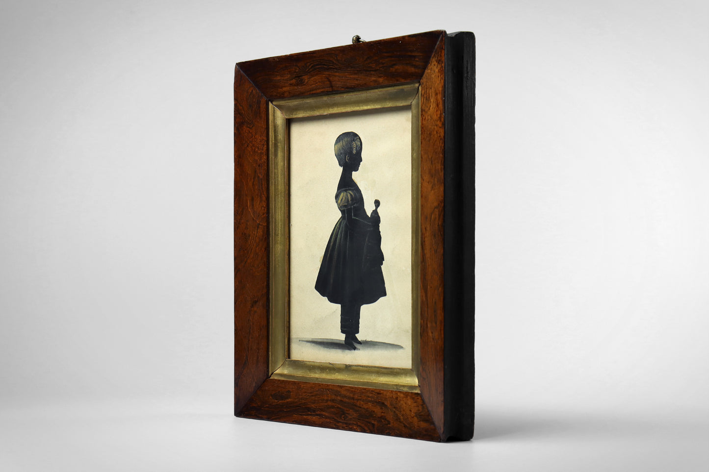 Cut Silhouette of a Girl With Doll